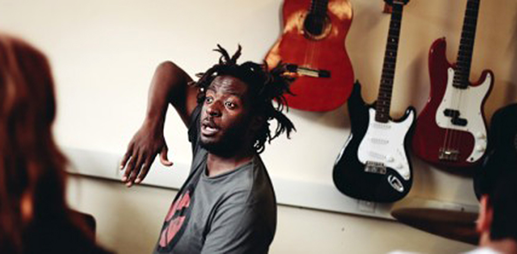 IF Trust partner charity Hear Me Out - image shows young black musician teaching a class